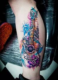 腿部个性彩绘吉他音乐纹身图案